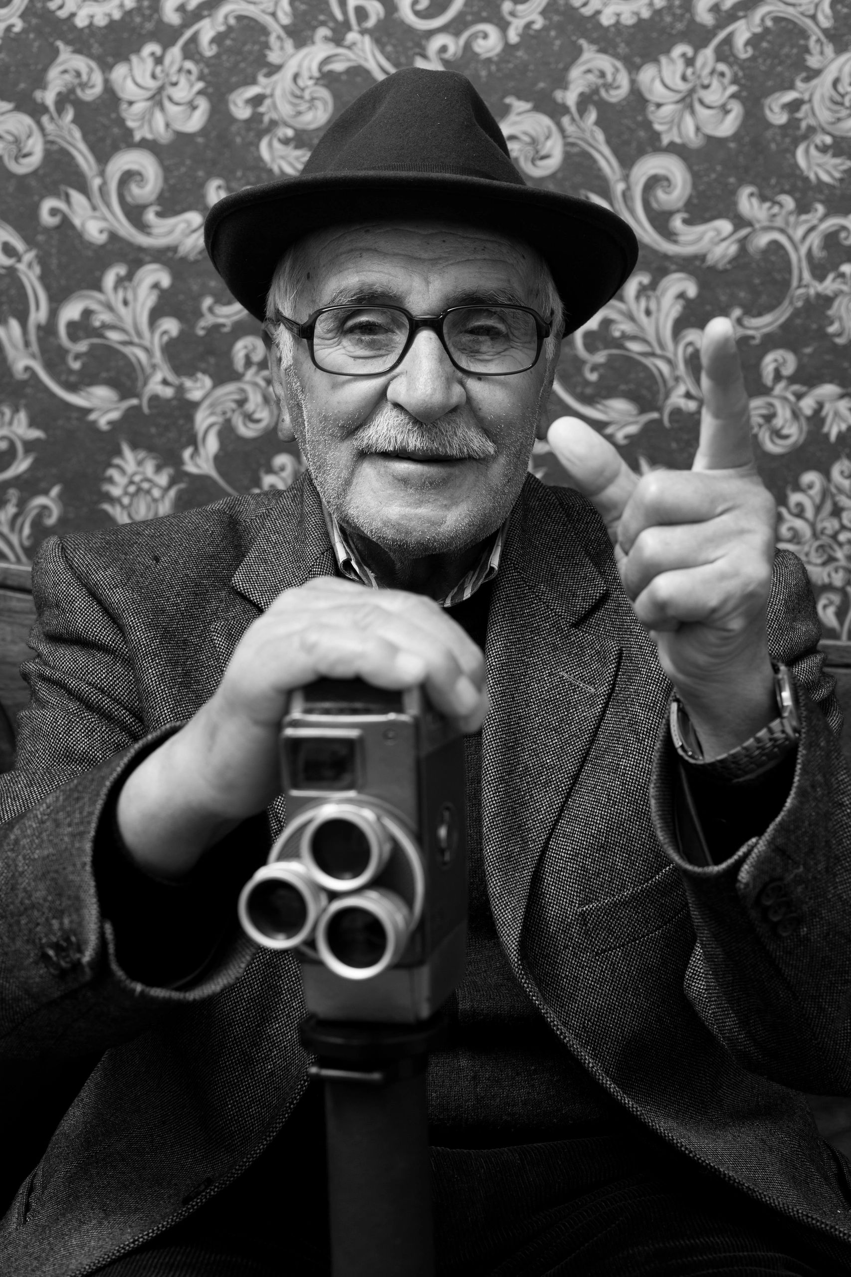 Videographer holding a vintage film camera