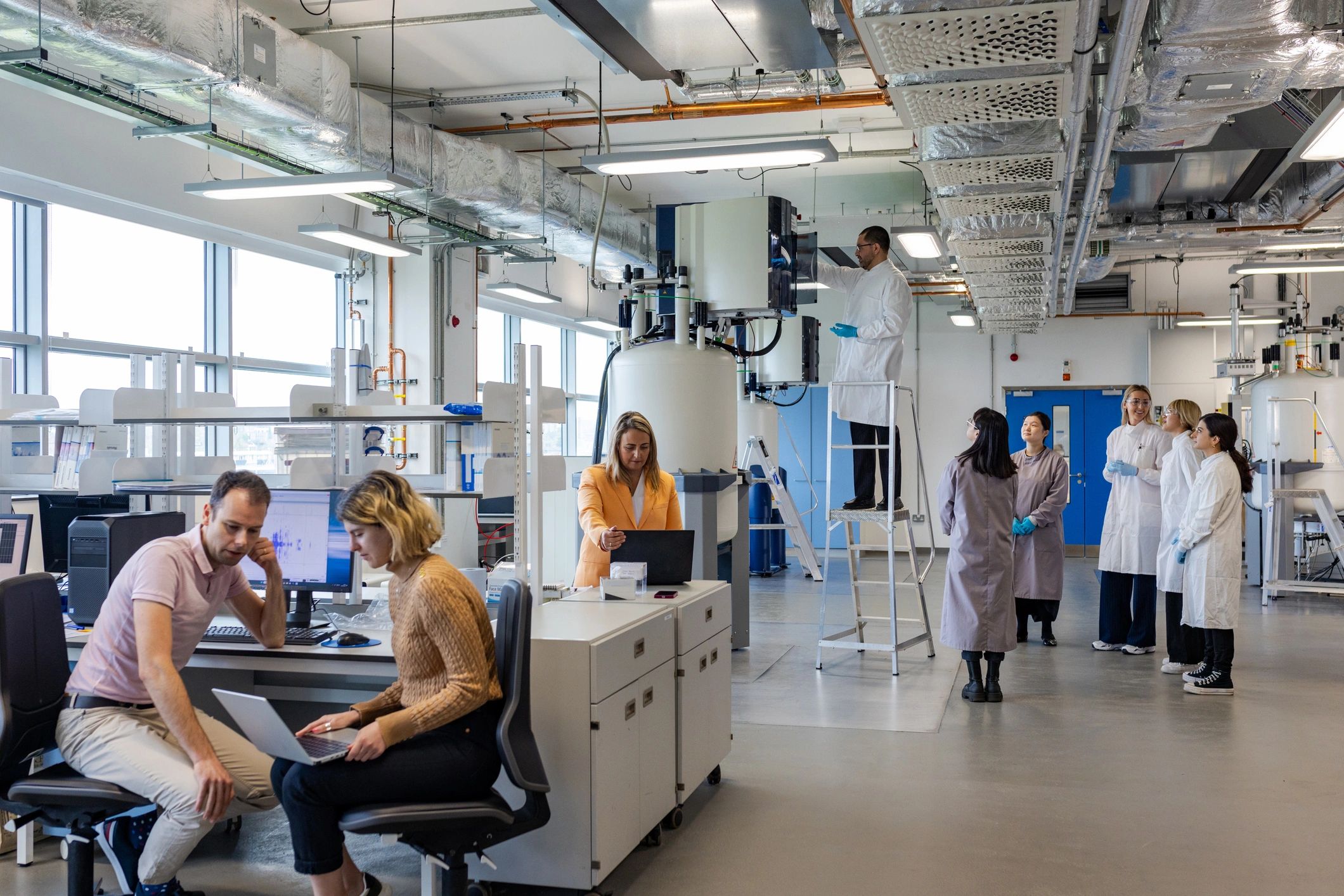 Scientists collaborating in a modern research laboratory