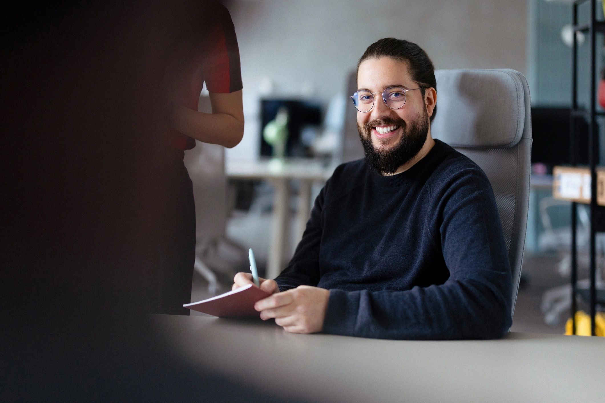 Writer holding a notebook, ready to share a story