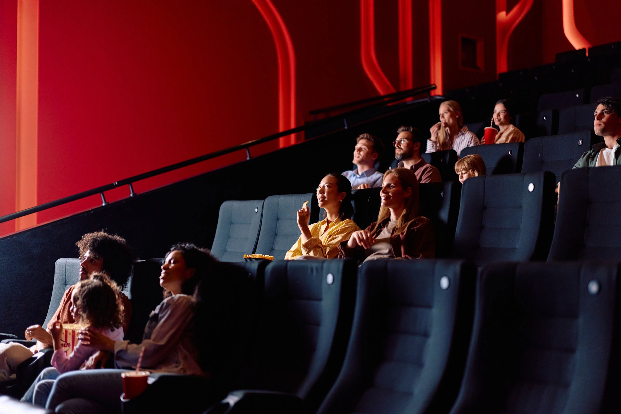 Audience watching a film together in a cinema
