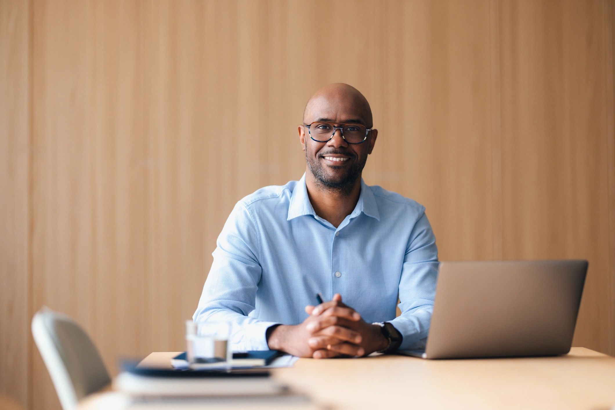 Business professional seated at an office meeting table